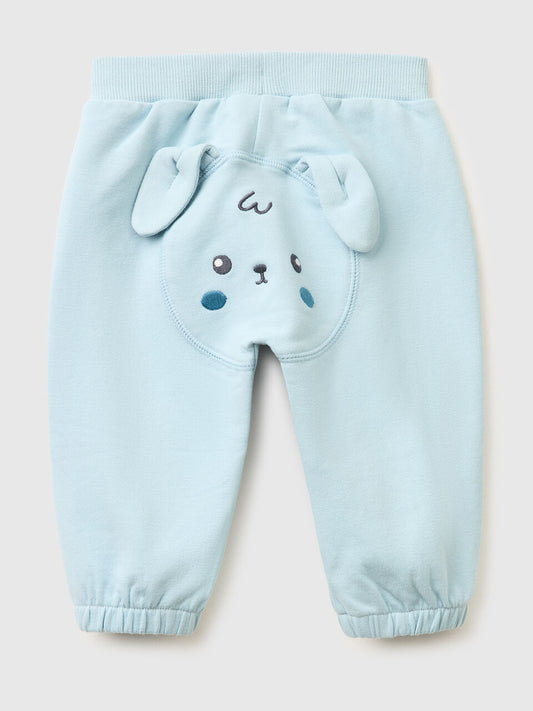 TROUSERS WITH EMBROIDERY ON THE BACK